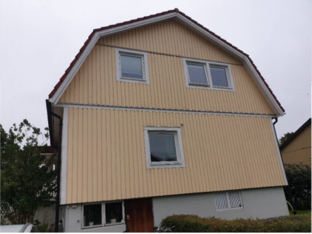 Bild för uppdrag: Fasadmålning av ett hus i Stockholm