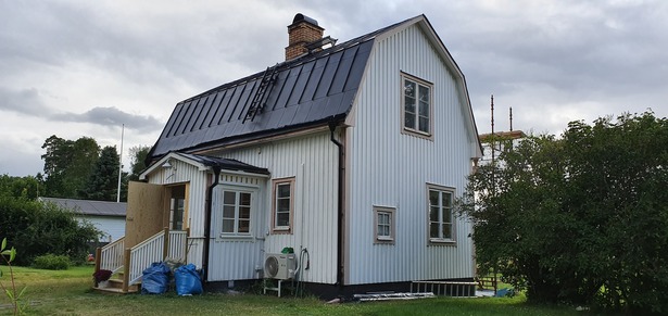 Bild för uppdrag: Fasadmålning av ett hus i Tierp